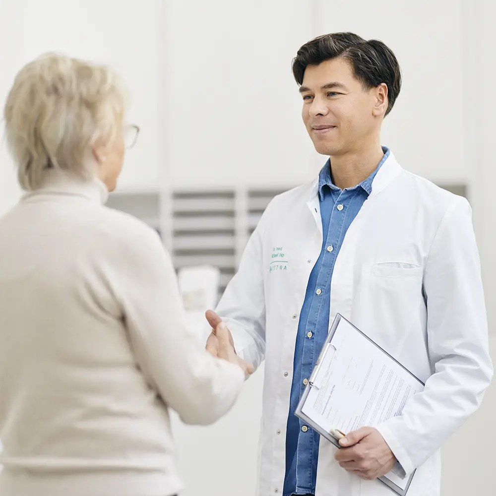 Dr. Ho greets patient